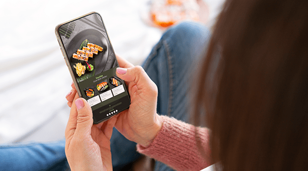 Women ordering food from a restaurant mobile ordering app